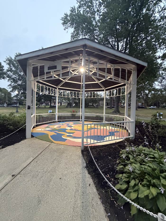 Gazebo at dusk, mural underfoot