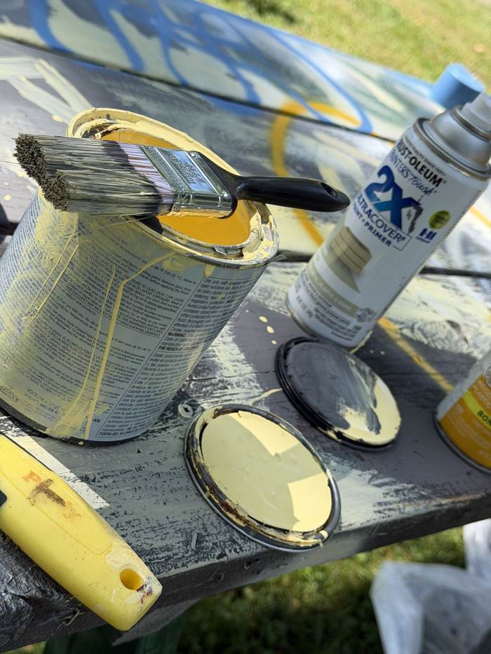 Paint cans and brushes, mid-project